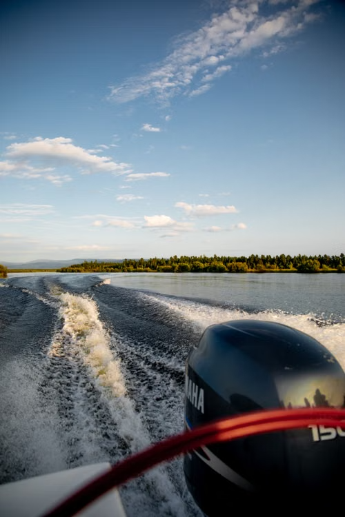 Speedboat powered by a Yamaha outboard motor cruising across a lake